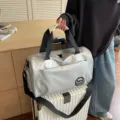 Large capacity silver waterproof travel duffle bag with trolley sleeve and shoulder strap - Silver
