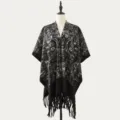 Black and white patterned knitted poncho shawl for women, stylish fringe design, cozy and warm. - Ink Paisley Black