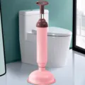 Handheld pneumatic toilet plunger with strong suction and stainless steel rod for bathroom. - Nordic Pink
