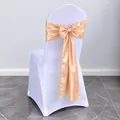 Elegant champagne satin chair sash with a large bow decoration for wedding party event - Apricot
