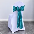 Elegant teal satin chair sash tied in a large bow for wedding and banquet decoration - Teal