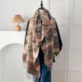 Detailed macro view of a vintage ethnic faux cashmere scarf featuring fringe and monograms - Letter D - Camel / 200*65cm