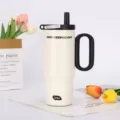 Large capacity stainless steel insulated tumbler with handle and straw for daily use. - Off-White - Black Handle