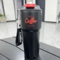 Stainless steel travel coffee mug, portable insulated tumbler with leakproof lid and strap. - 620ml New Model Black