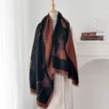 Detail view of a vintage horse pattern jacquard shawl with fringed edges on a mannequin. - Black Coffee