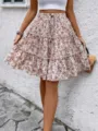 Zomerse dames bloemenprint gelaagde minirok, casual hoge taille trekkoord korte rok. - S / Abrikoos