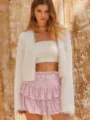 Close-up detail view of women's sparkling pink sequin ruffled miniskirt fashion apparel. - XS / Silver