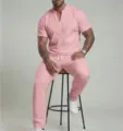 Detail view of men's pink short sleeve V-neck top and matching casual trousers set. - S / Top And Bottom / Pink