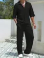 Detailed view of men casual knit set featuring black short sleeve shirt and matching pants. - S / Top And Bottom / Black