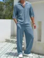 Detailed view of the men's casual textured two-piece short sleeve shirt and long pants set. - Sky Blue