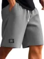Close up detail of men gray waffle knit casual shorts featuring adjustable drawstring waistband. - S / Bottoms / Gray