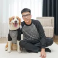 Detail shot of matching black and white striped pet and owner outfits in a cozy home indoor setting. - XS (Back Length 20cm) / Black & White Stripes