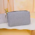 Black and white striped cosmetic bag, portable travel wash bag, zipper pouch variant. - Black and White