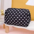 Black quilted cosmetic bag with white heart pattern, stylish portable storage travel pouch. - White Heart