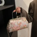 Elegante Vintage-Clutch mit Blumenstickerei, goldenem Griff und langer Ketten-Schulterriemen - Grau