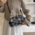Vintage black floral embroidered evening handbag with elegant gold metal circular handle - Black