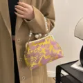Elegant Chinese-style embroidered handbag with pearl handle in yellow and purple - Gold