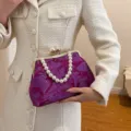 Elegant purple Chinese style embroidered handbag featuring a pearl handle and gold chain - Red