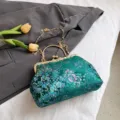 Elegante borsa a mano verde vintage stile cinese con motivo floreale e telaio dorato - Verde