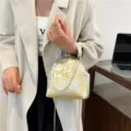 Elegant white and gold silk handbag with pearl handle and golden metal chain strap - Gold