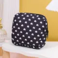 Black quilted cosmetic bag with white heart pattern, portable makeup pouch for daily use. - White Heart