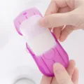 Portable disposable soap paper sheets in a plastic travel box for outdoor hand washing. - Purple