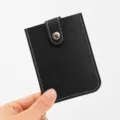 Compact black PU leather card holder with snap button closure and multiple slots for portable use. - 11*8cm / Black