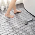 Bathroom anti-slip shower mat detail showing interlocking gray grid surface and floor use. - 30cm*30cm / Gray
