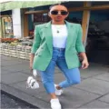 Detail view of a fashionable green double breasted lapel blazer jacket for women, stylish. - S / Green