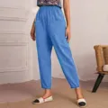 Detail view of casual women pants featuring elastic waist, large pockets and stylish cuffed hems. - Sky Blue
