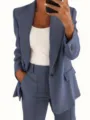 Detailed view of the stylish solid color slim fit blazer and pants suit for women. - S / Tops / Blue