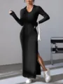 Close-up details of the women's black ribbed long sleeve polo maxi dress with side slit. - S / Black