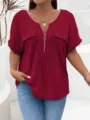 Detailed view of women red V-neck ribbed zip short sleeve top paired with classic blue jeans. - 1XL / Burgundy