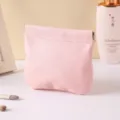 Mini pink leather cosmetic pouch with automatic spring closure, portable lipstick storage bag. - Pink