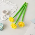 Macro detail of three creative silicone gel pens featuring yellow lotus flower toppers - 0.5mm (Black Ink) / Yellow