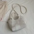 Elegant beige plaid bucket bag with a top handle and an adjustable shoulder strap - White Bag Only