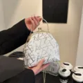 White shell bag with silver sequins, gold clasp, and chain strap for women - Silver