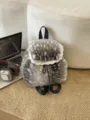 Faux fur backpack featuring lace trim and drawstring closure in a grey spotted pattern - Single Bag / Light Gray