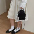 Elegante mochila mini con estampado de leopardo, encaje blanco y lazo en acabado negro - Estilo Con Colgante / Negro