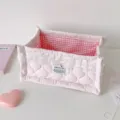 Detailed view of pink quilted fabric storage basket with lace trim and gingham lining - L / Pink
