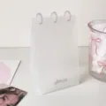 Detailed close-up of a minimalist transparent PP desk photo album for photocards. - 1 Slot (Includes 10 Inner Pages)