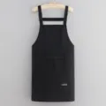 Solid color waterproof oilproof kitchen apron with pockets and adjustable straps for daily cooking. - Black