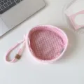 Detailed inside view of a pink plush doll storage bag with cute gingham lining - Pink