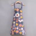 Stylish canvas kitchen apron with colorful daisy floral pattern and front pocket for cooking. - Regular Fit / Chrysanthemum on Blue Background