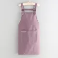Stylish purple kitchen apron with pockets and adjustable straps, perfect for home cooking. - Purple