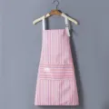 Kitchen striped apron with adjustable white straps and front pocket for cooking and baking. - Red