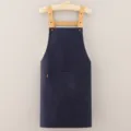Dark blue canvas work apron with front pocket and adjustable shoulder straps, durable style. - Blue
