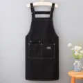 Grembiule da cucina nero in tela con tasche, spallacci regolabili, abbigliamento da lavoro durevole. - Nero