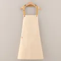 Grembiule da cucina classico in cotone con spallacci regolabili e comoda tasca anteriore. - Beige