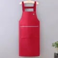 Red waterproof kitchen apron with H-shaped straps and front pocket for cooking and work. - Burgundy